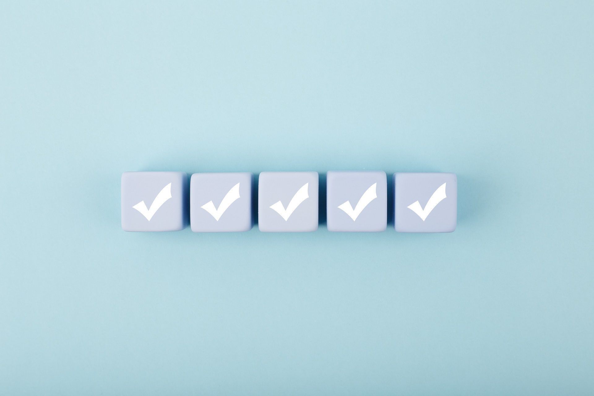 5 boxes with a checkmark, symbolizing how to boost email engagement with quality